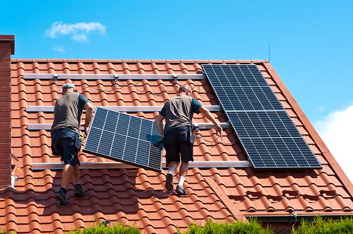 Solar panels being installed on a home's roof to improve energy efficiency and generate renewable energy.