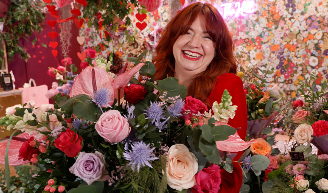Woman smiling with flowers