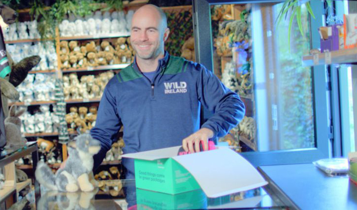 Man packing an An Post parcel