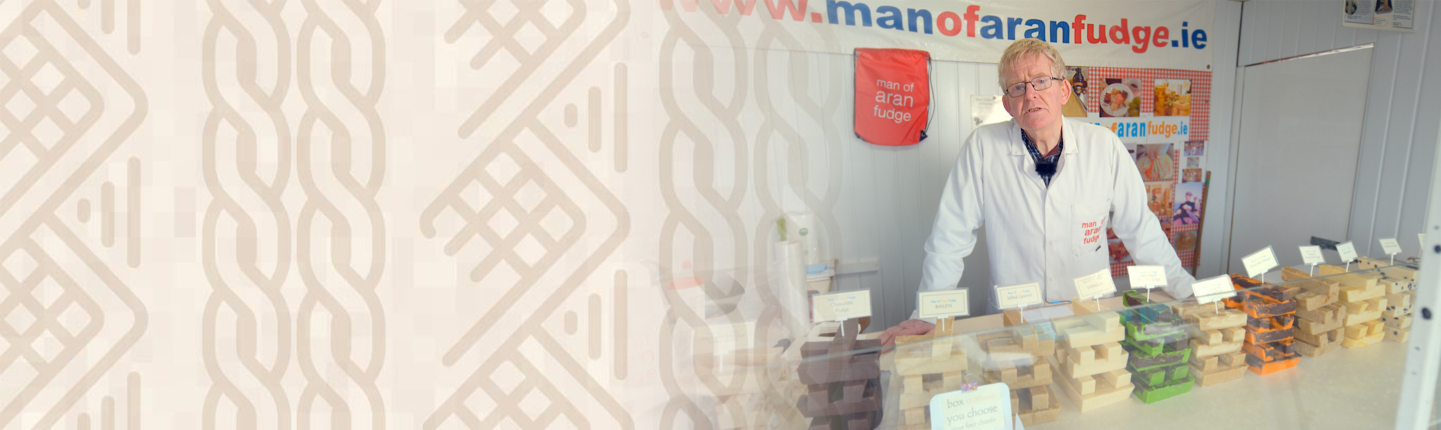 Man standing in front of a table of fudge 