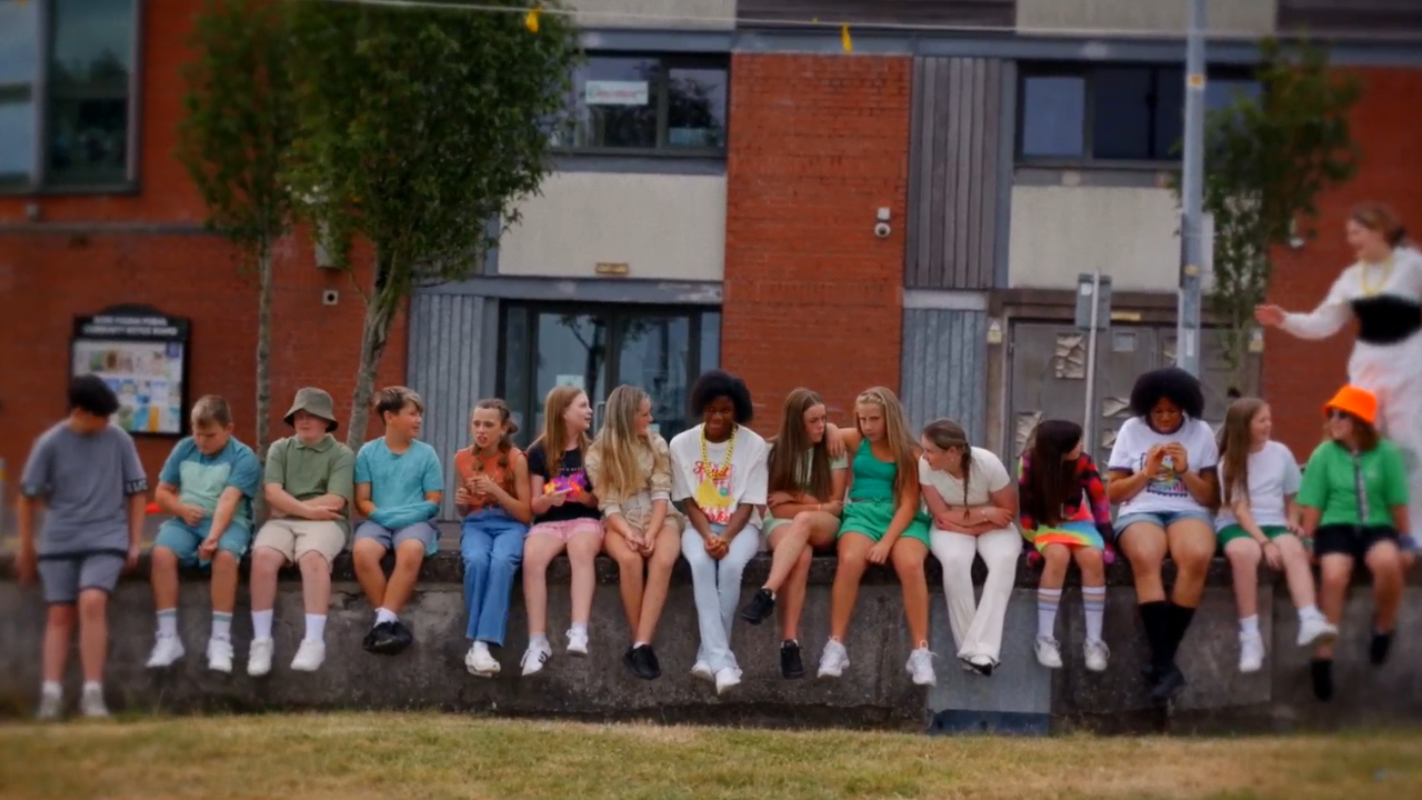 kids sitting on wall